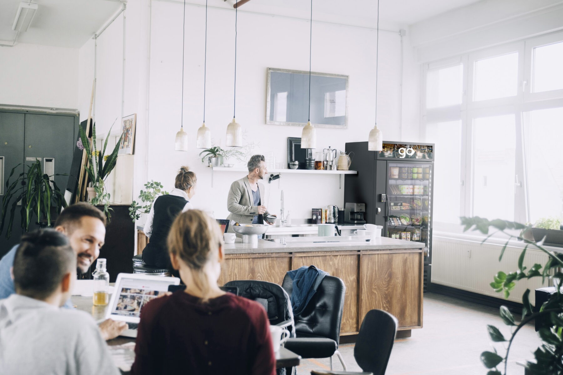 Creative male and female entrepreneurs working in office